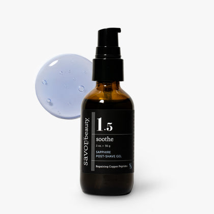 A bottle of Savor Beauty 1.5 Soothe Post-Shave Gel in an amber glass bottle with a black pump and black label, shown on a light gray background with a translucent blue gel droplet graphic behind it.