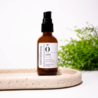 Chamomile Mask standing on stone beige tray with greenery in the backround