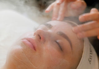 Spa guest receiving a steamy facial cleanse