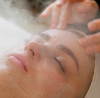 Spa guest receiving a steamy facial cleanse